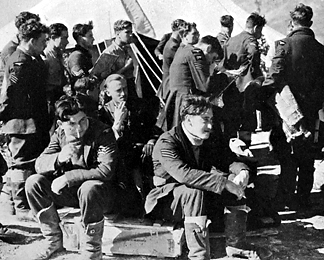 Aircrews outside the operations tent